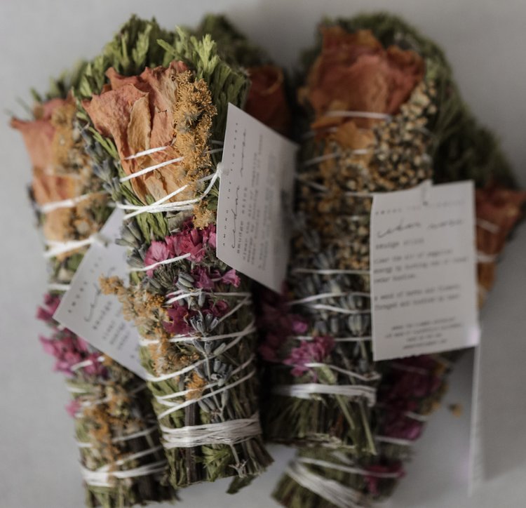 Shop Beyond the Flowers Smudge Wands in Canada. A bouquet of dried herbs and flowers, hand-bound with love out of materials we harvest ourselves from our own land. Made to release negative vibrations, lift consciousness, and bring about new life.