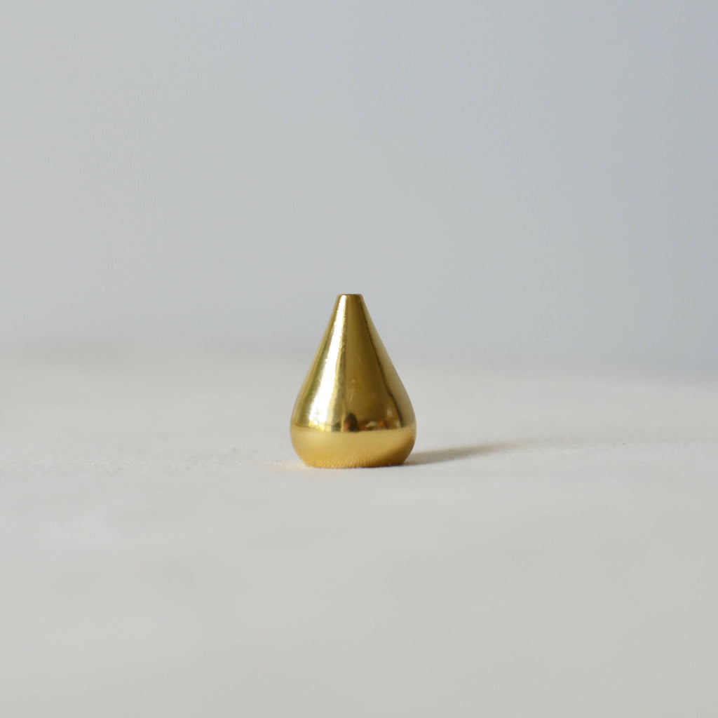 Cedar & Myrrh Brass Incense Holder | Tear Drop. This incense holder offers a minimalist design made of solid brass. The holder is versatile and can be used by itself, inside a bowl or on top of a plate. The diameter of the holes are about 1mm, 2mm, 3mm which is suitable for thread incense.