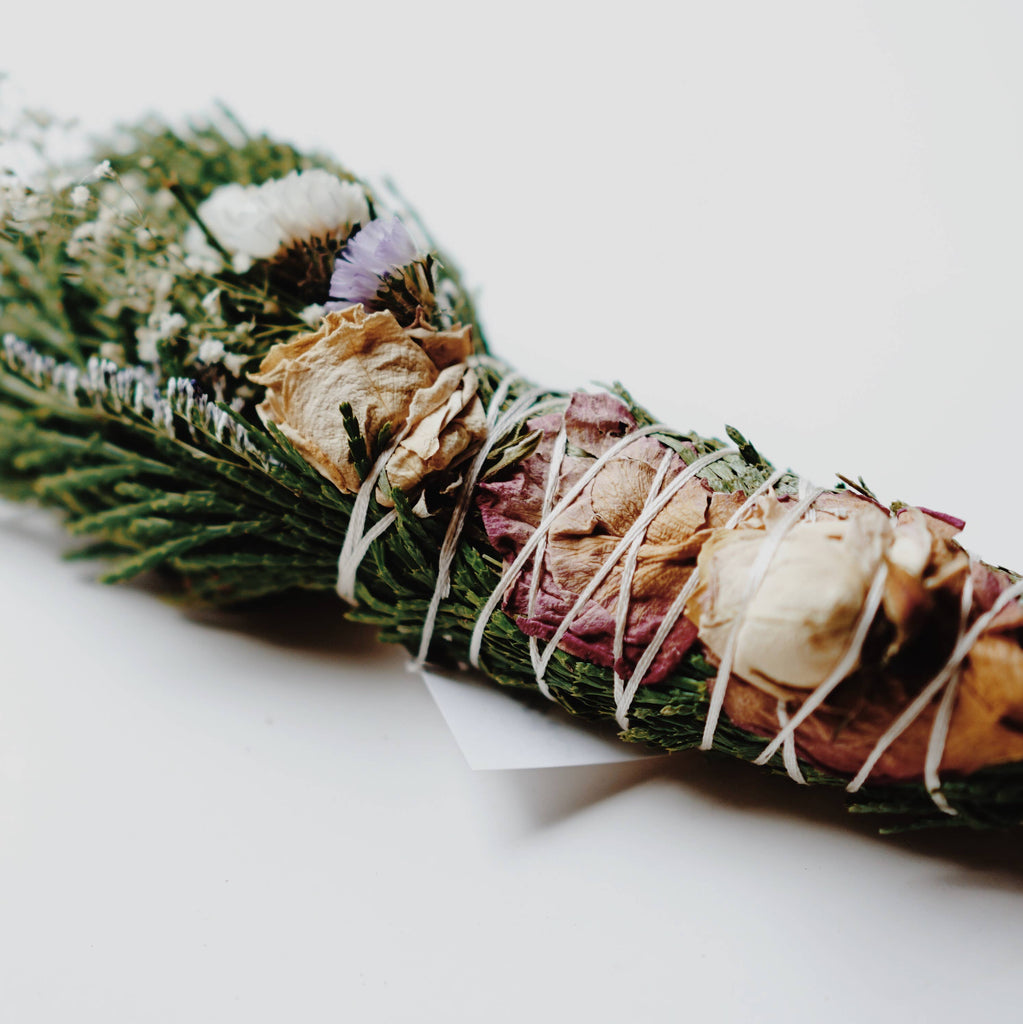 Shop Beyond the Flowers Smudge Wands in Canada. A bouquet of dried herbs and flowers, hand-bound with love out of materials we harvest ourselves from our own land. Made to release negative vibrations, lift consciousness, and bring about new life. 