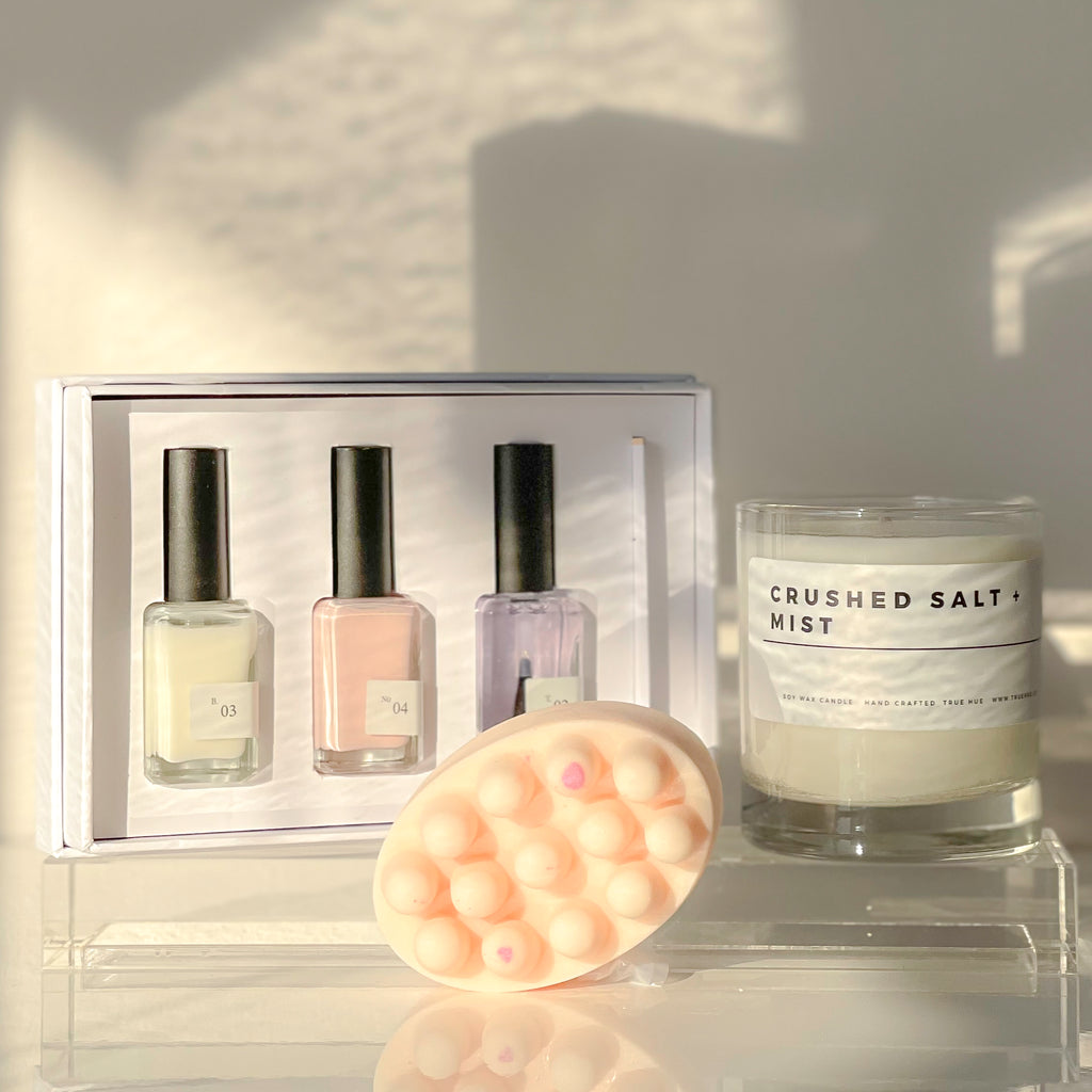 Shop our Cutie Collection Gift Basket. This collection includes a Sundays Studio nail polish trio kit, a natural soap bar made specifically to massage sore muscles and a True Hue soy candle. This is the perfect present for the girl who likes to paint her nails a new colour every week and light a candle for a warm bath.