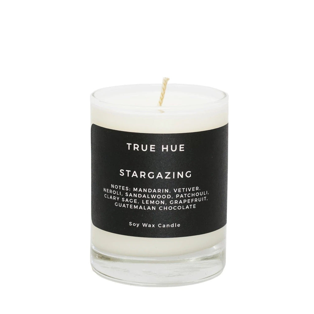 Tru Hue Stargazing Soy Wax Candle with notes of Mandarin & Vetiver. 7.75oz. Laying on the cool grass under meteor showers. Stars dash against the dark blue atmosphere. Mandarin, vetiver root, and sandalwood. Each candle comes complete with a premium cotton wick which burns cleanly for 40–50 hours.